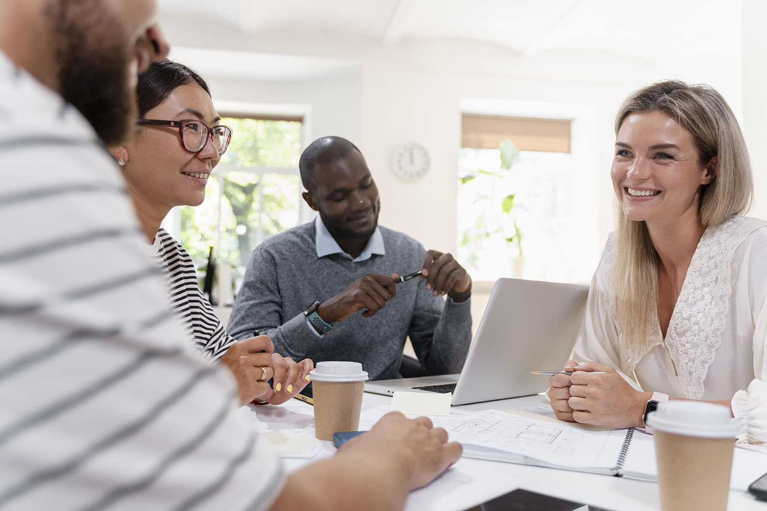 close-up-young-colleagues-having-meeting